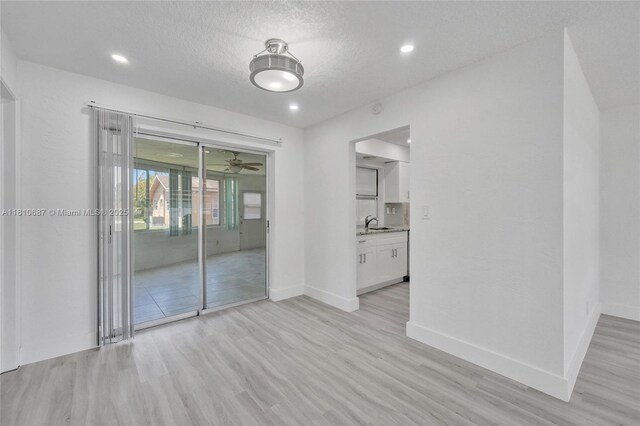7204 NW 76th Dr, Tamarac, FL 33321 - empty room with light wood-style floors, ceiling fan, recessed lighting, and a textured ceiling