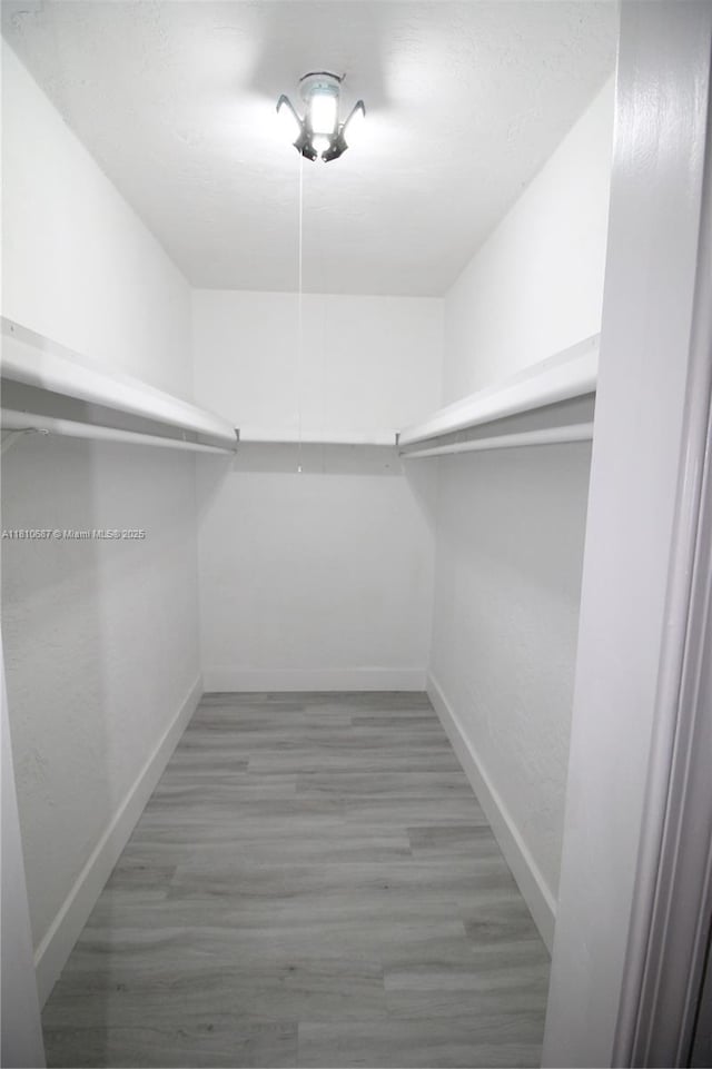 7204 NW 76th Dr, Tamarac, FL 33321 - spacious closet with wood finished floors