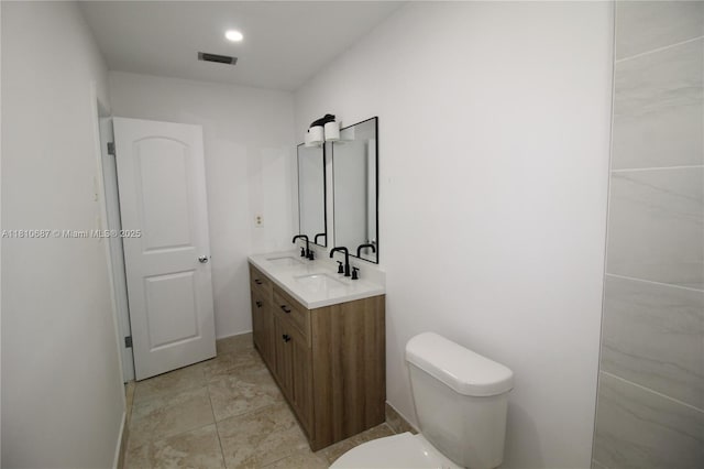 7204 NW 76th Dr, Tamarac, FL 33321 - bathroom with double vanity, toilet, and baseboards
