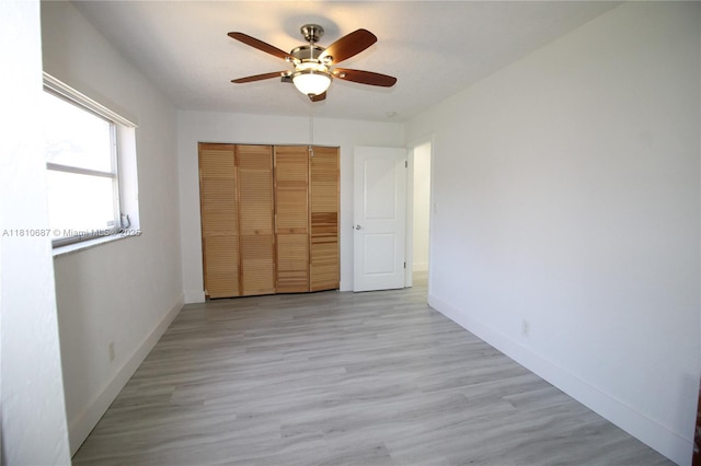 7204 NW 76th Dr, Tamarac, FL 33321 - unfurnished bedroom with a closet, light wood finished floors, baseboards, and ceiling fan