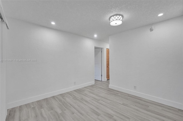 7204 NW 76th Dr, Tamarac, FL 33321 - empty room with light wood-style flooring and recessed lighting