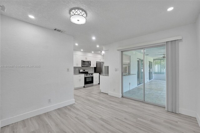 7204 NW 76th Dr, Tamarac, FL 33321 - unfurnished living room featuring light wood-type flooring, recessed lighting, and a ceiling fan