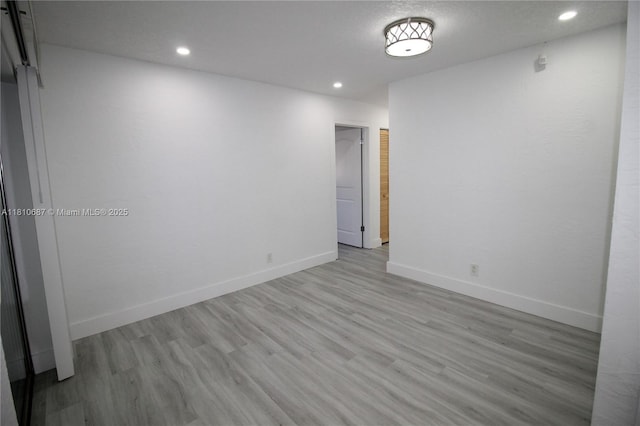 7204 NW 76th Dr, Tamarac, FL 33321 - empty room with wood finished floors, recessed lighting, and baseboards