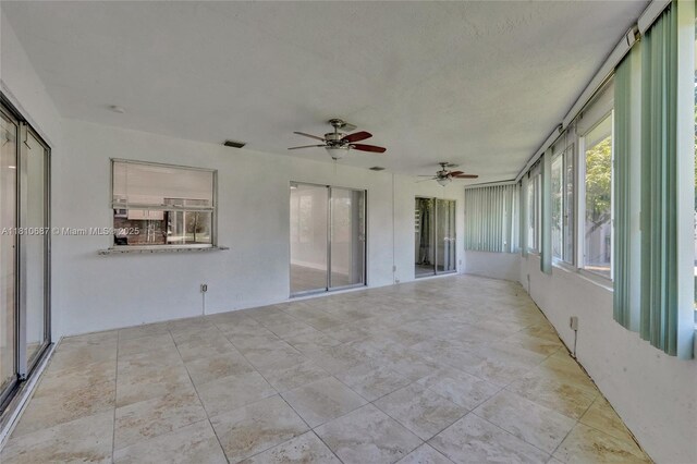 7204 NW 76th Dr, Tamarac, FL 33321 - unfurnished sunroom with ceiling fan
