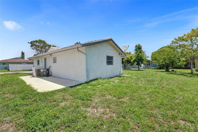 7204 NW 76th Dr, Tamarac, FL 33321 - rear view of property with stucco siding, a lawn, and a patio area