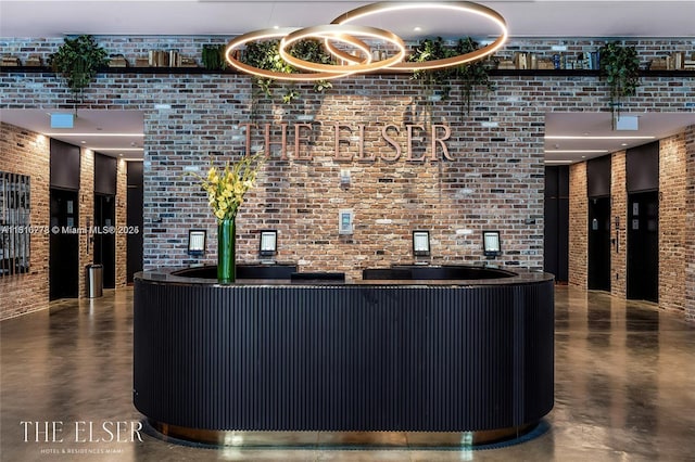 398 NE 5th St Unit 4608, Miami, FL 33132 - reception area featuring brick wall and wet bar