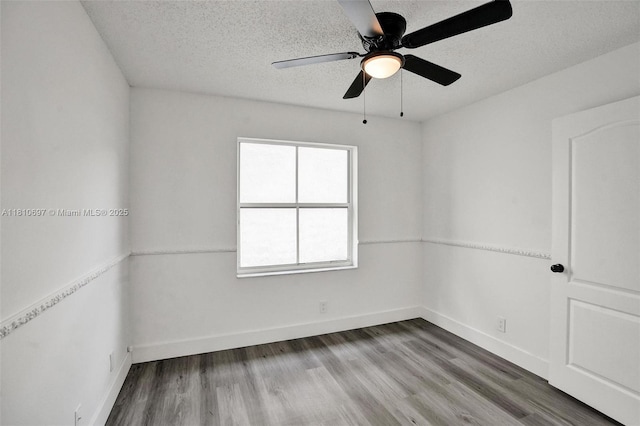 7325 Flores Way, Margate, FL 33063 - empty room featuring a textured ceiling, wood finished floors, baseboards, and ceiling fan