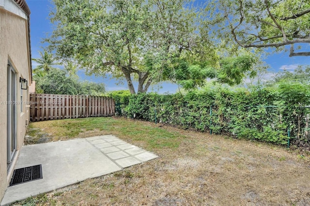 7325 Flores Way, Margate, FL 33063 - fenced backyard featuring a patio