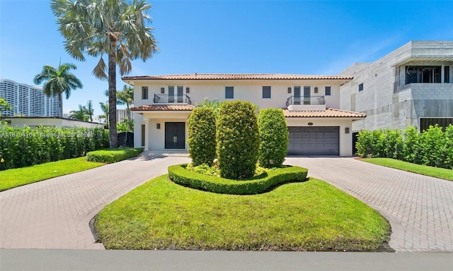 275 189th Ter, Sunny Isles Beach, FL 33160 - mediterranean / spanish home with a balcony, decorative driveway, a tile roof, and stucco siding