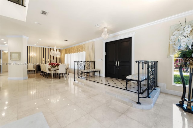 275 189th Ter, Sunny Isles Beach, FL 33160 - entryway with a chandelier, crown molding, baseboards, tile patterned flooring, and recessed lighting