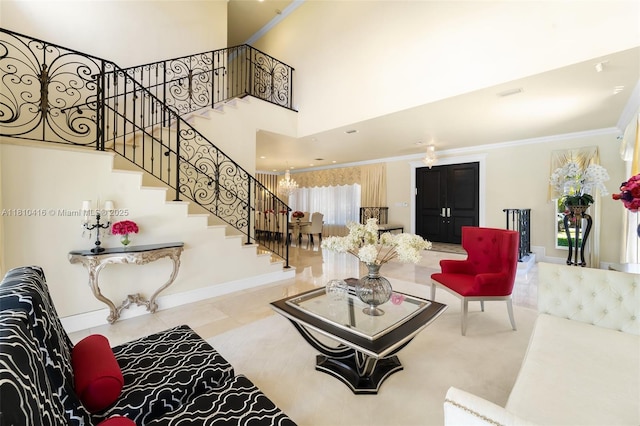 275 189th Ter, Sunny Isles Beach, FL 33160 - tiled living area featuring stairs, ornamental molding, baseboards, and a high ceiling