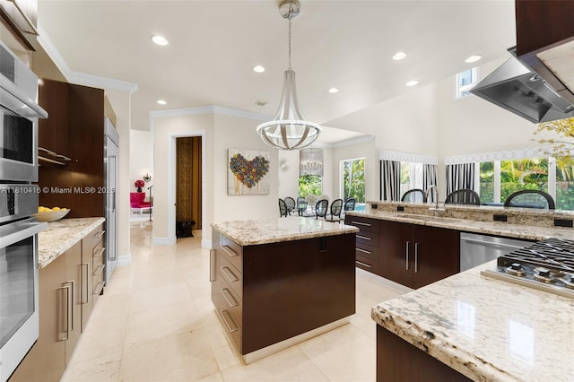 275 189th Ter, Sunny Isles Beach, FL 33160 - kitchen with a center island, a sink, stainless steel appliances, recessed lighting, and extractor fan