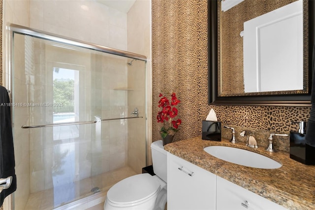 275 189th Ter, Sunny Isles Beach, FL 33160 - full bathroom featuring toilet, vanity, a shower stall, and backsplash
