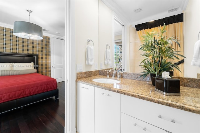 275 189th Ter, Sunny Isles Beach, FL 33160 - ensuite bathroom with vanity, ornamental molding, and wood finished floors