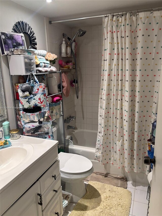 807 W Oakland Park Blvd Unit G1, Oakland Park, FL 33311 - bathroom featuring shower / bathtub combination with curtain, vanity, tile patterned floors, and toilet