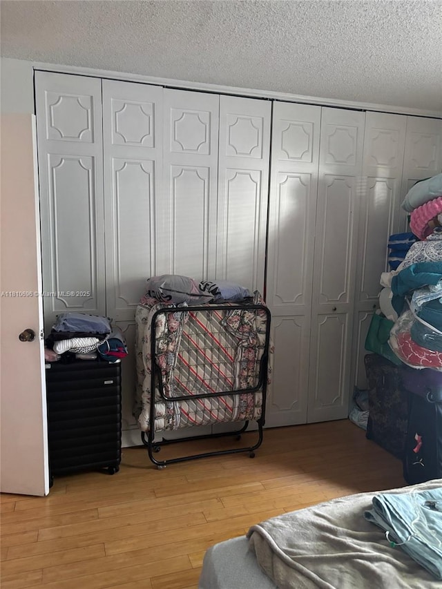 807 W Oakland Park Blvd Unit G1, Oakland Park, FL 33311 - bedroom with light wood-type flooring and a textured ceiling