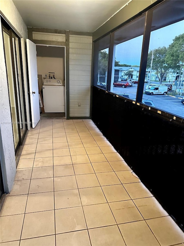 20760 NE 4th Ct Unit 201, Miami, FL 33179 - hall with light tile patterned floors and washing machine and dryer