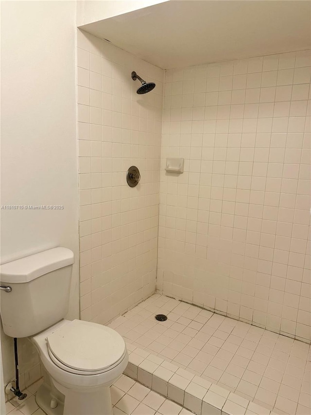 20760 NE 4th Ct Unit 201, Miami, FL 33179 - bathroom featuring tile patterned flooring, a tile shower, and toilet