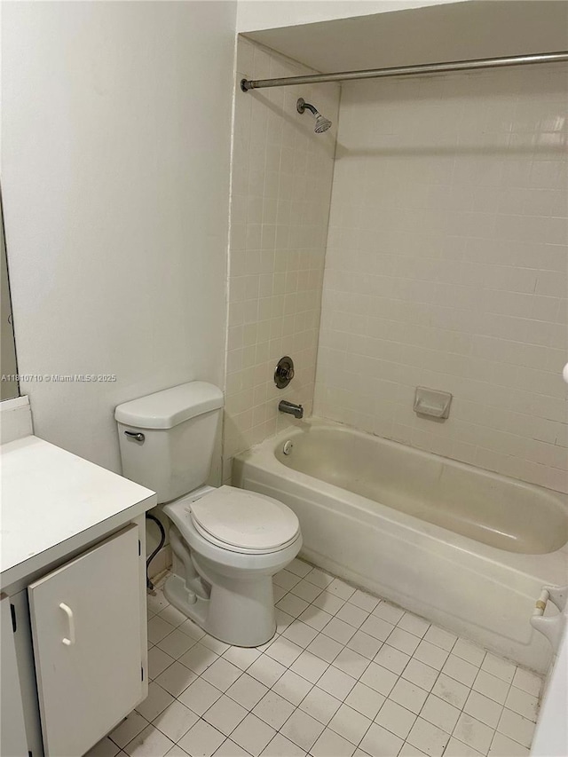 20760 NE 4th Ct Unit 201, Miami, FL 33179 - full bath featuring vanity, washtub / shower combination, tile patterned flooring, and toilet