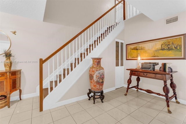 13731 SW 103rd Ter, Miami, FL 33186 - staircase featuring baseboards and tile patterned floors