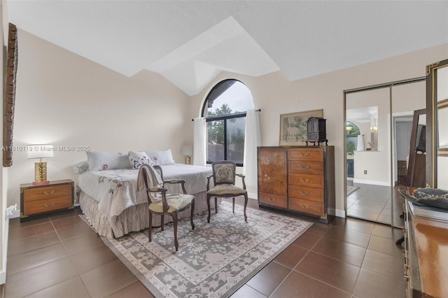 13731 SW 103rd Ter, Miami, FL 33186 - bedroom featuring dark tile patterned flooring and lofted ceiling