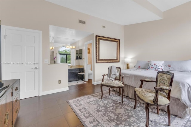 13731 SW 103rd Ter, Miami, FL 33186 - bedroom featuring a chandelier, dark tile patterned flooring, and ensuite bath