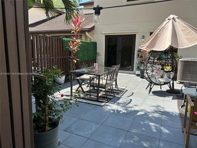 13731 SW 103rd Ter, Miami, FL 33186 - view of patio / terrace with outdoor dining space and french doors