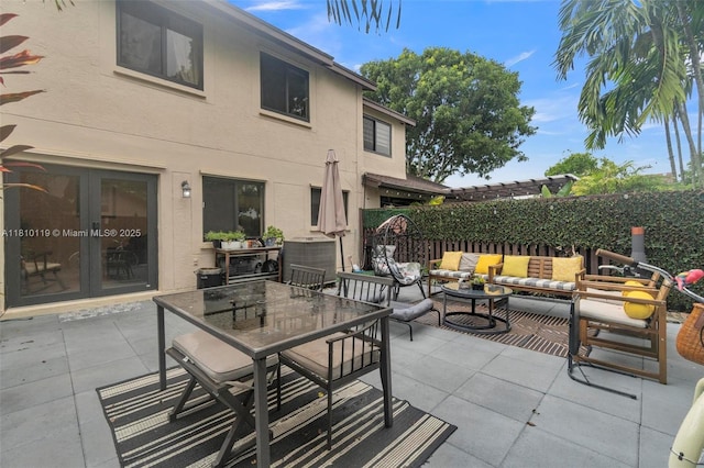 13731 SW 103rd Ter, Miami, FL 33186 - view of patio featuring french doors, an outdoor hangout area, and outdoor dining area