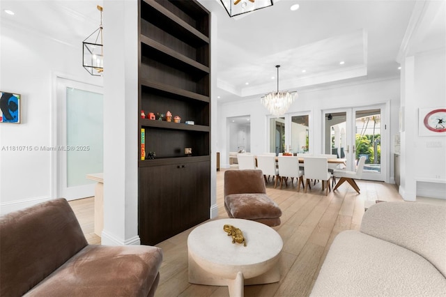 1210 95th St, Bay Harbor Islands, FL 33154 - living room featuring a chandelier, ornamental molding, recessed lighting, light wood finished floors, and a tray ceiling