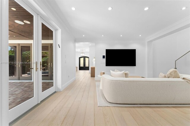 1210 95th St, Bay Harbor Islands, FL 33154 - living room featuring recessed lighting, light wood finished floors, french doors, ornamental molding, and baseboards