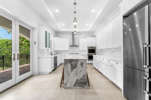 1210 95th St, Bay Harbor Islands, FL 33154 - kitchen featuring appliances with stainless steel finishes, wall chimney exhaust hood, a sink, tasteful backsplash, and ornamental molding