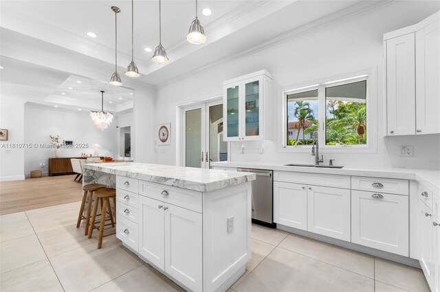 1210 95th St, Bay Harbor Islands, FL 33154 - kitchen with dishwasher, ornamental molding, a sink, a raised ceiling, and a center island