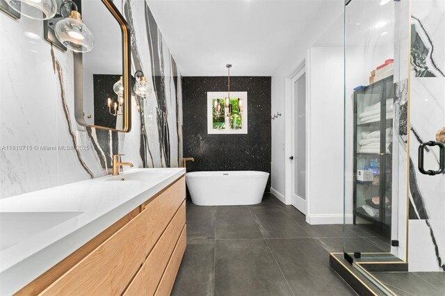 1210 95th St, Bay Harbor Islands, FL 33154 - full bath with double vanity, a stall shower, a soaking tub, and tile patterned floors