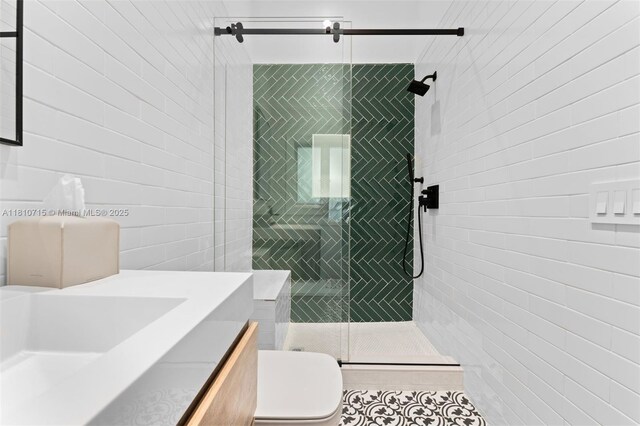 1210 95th St, Bay Harbor Islands, FL 33154 - bathroom featuring tile walls, toilet, vanity, a stall shower, and tile patterned flooring