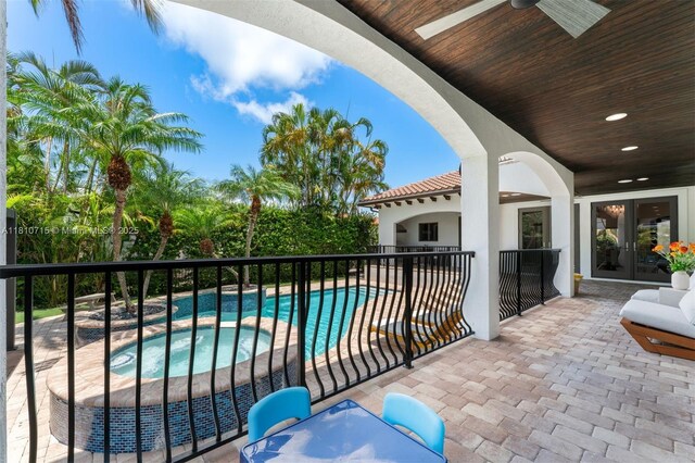 1210 95th St, Bay Harbor Islands, FL 33154 - balcony featuring an in-ground hot tub, view of pool area, a ceiling fan, french doors, and a patio