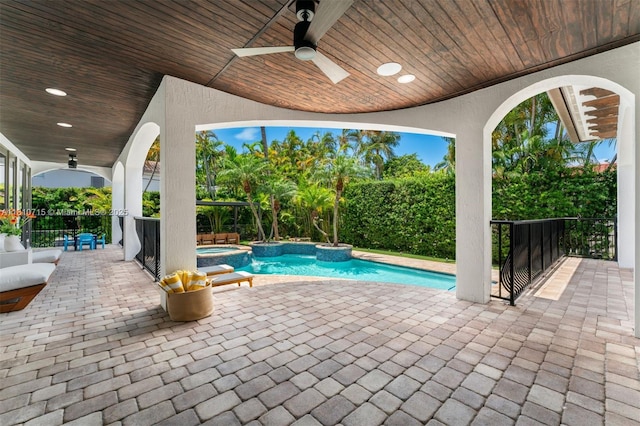 1210 95th St, Bay Harbor Islands, FL 33154 - view of swimming pool with ceiling fan, a pool with connected hot tub, and a patio area