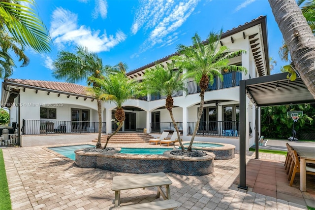 1210 95th St, Bay Harbor Islands, FL 33154 - view of pool featuring french doors, a patio area, and a pool with connected hot tub