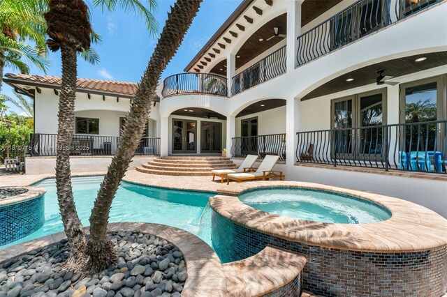 1210 95th St, Bay Harbor Islands, FL 33154 - view of pool with ceiling fan, a pool with connected hot tub, a patio area, and french doors