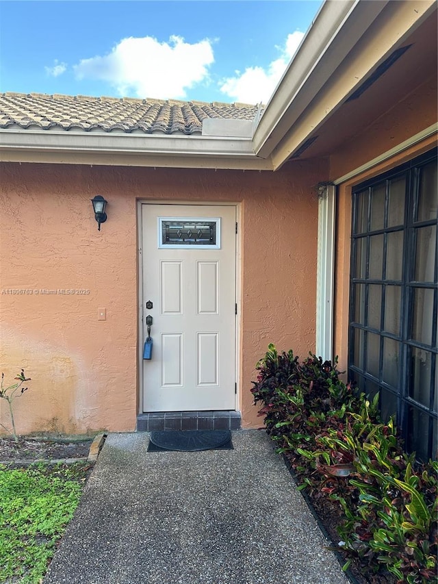 3030 NW 116th Ave, Coral Springs, FL 33065 - doorway to property with stucco siding