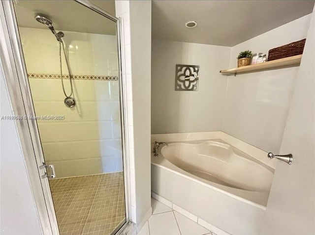 1650 Coral Way Unit 403, Miami, FL 33145 - full bathroom featuring a garden tub, a stall shower, and tile patterned flooring