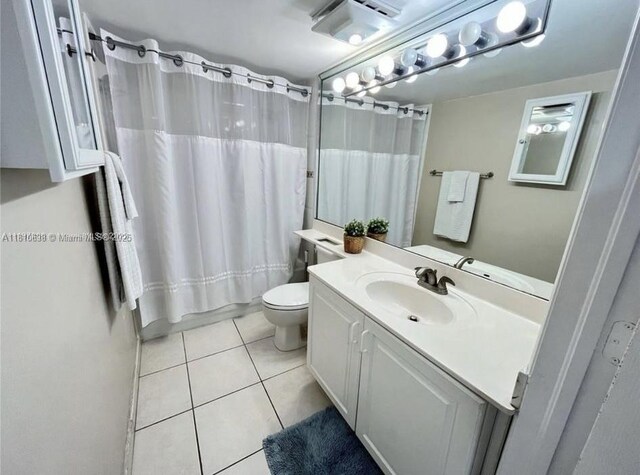 1650 Coral Way Unit 403, Miami, FL 33145 - full bath with vanity, tile patterned floors, toilet, and shower / tub combo