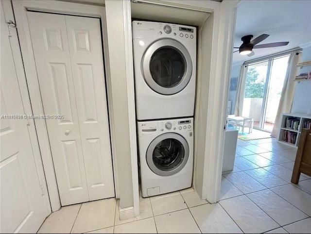 1650 Coral Way Unit 403, Miami, FL 33145 - laundry room featuring stacked washer / dryer, light tile patterned flooring, and ceiling fan