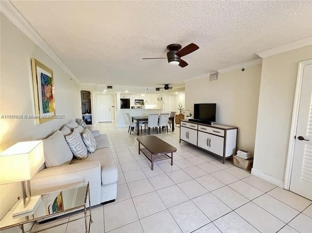 1650 Coral Way Unit 403, Miami, FL 33145 - living room with ceiling fan, crown molding, light tile patterned floors, a textured ceiling, and baseboards