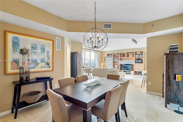 1819 SE 17th St Unit 1501, Fort Lauderdale, FL 33316 - dining space featuring a chandelier and baseboards