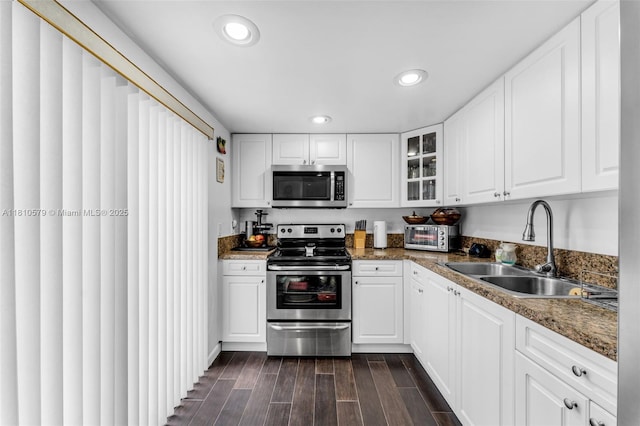 8341 SW 157th Ave Unit 304, Miami, FL 33193 - kitchen with stainless steel appliances, a sink, glass insert cabinets, dark wood-style flooring, and recessed lighting
