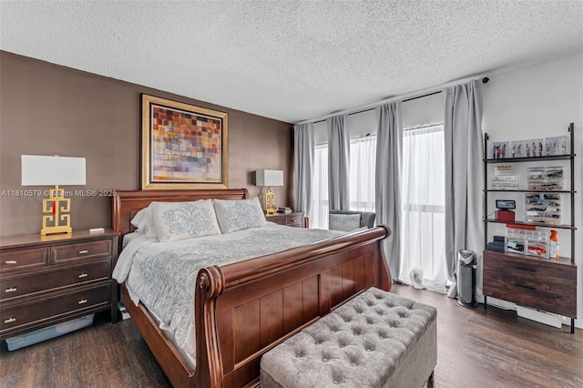 8341 SW 157th Ave Unit 304, Miami, FL 33193 - bedroom with a textured ceiling and dark wood-style floors