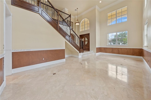 10733 SW 97th Ter, Miami, FL 33176 - foyer entrance with crown molding, stairway, baseboards, and a high ceiling