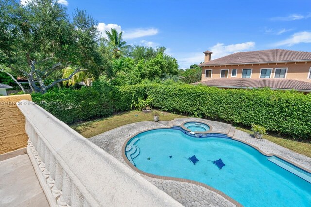 10733 SW 97th Ter, Miami, FL 33176 - view of swimming pool with a pool with connected hot tub
