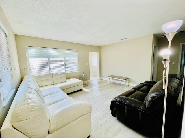 1002 S 27th Ave, Hollywood, FL 33020 - living room with light wood finished floors and baseboards
