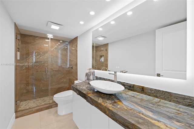 1501 S Ocean Dr Unit 1005, Hollywood, FL 33019 - full bathroom with vanity, recessed lighting, a stall shower, tile patterned floors, and toilet